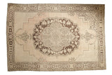 Distressed Oushak carpet, chocolate brown scalloped medallion on antique ivory and blush.