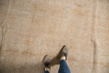 Distressed vintage Sivas carpet, with visible texture, faint patterns, and neutral tones.
