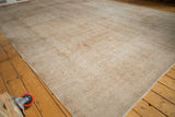 Distressed Sivas carpet texture with neutral antique ivory and pale bronze tones.
