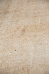 Tightly woven natural fiber foundation of vintage Sivas carpet with processing marks.