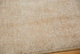 Reverse side of the distressed Sivas carpet, showing tightly woven natural tone foundation.
