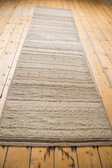 Angled perspective of a vintage Jijim runner showing its full length and textured, banded design.