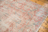 Distressed texture and softened blush, ivory, ocean green patterns with fringe on vintage Sparta rug.