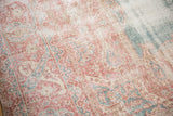 Detail of worn pile and foundation revealing time-softened blush, rose, and blue hues.