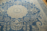 Textural distressed vintage Kerman rug with indigo blue and ivory floral vinery.