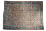 Vintage distressed Tabriz carpet with scrolling floral arabesques in teal, beige, and blush.