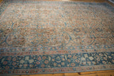 Distressed Vintage Tabriz carpet detail: scrolling teal, beige, blush florals with even pile wear.