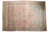 Distressed vintage Meshed carpet, faded medallion, intricate vinery in blush and dusty teal.