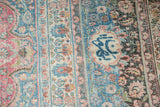 Distressed vintage Meshed carpet with even wear, intricate floral vinery, dusty teal, raspberry.