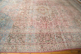 Distressed vintage Meshed carpet corner, with pale raspberry and dusty teal floral vinery.