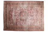 Distressed vintage Persian Meshed carpet, intricate floral medallion, fuscia, raspberry, charcoal, and ivory hues.