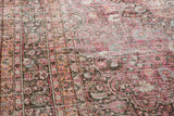 Distressed fuscia, peach, and charcoal tones in a floral pattern with exposed knot heads.