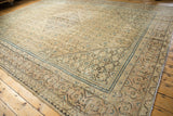 Distressed vintage Mahal carpet, showing central diamond medallion and faded Herati patterns.