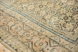 Distressed Mahal carpet with faded indigo zig-zag border and Herati pattern.