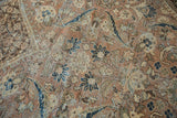 Distressed vintage Mahal carpet detail, showing worn pile, floral motifs, and foundation.