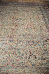 Vintage distressed Khorassan carpet with even wear, faded ivory, blue, and red palmettes.