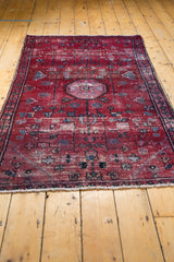 Secure fringe and isolated wear on the deep cherry red geometric-floral vintage Lilihan rug.
