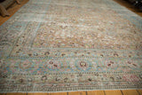 Vintage distressed Meshed carpet showcasing faded allover floral design with sky blue and antique ivory.