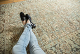 Distressed Heriz carpet with pale sea foam blue and beige rectilinear geometric design.