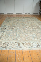 Distressed fringe and border with large-scale pomegranates and serrated leaves in pale sea foam and ivory.