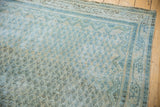 Distressed Persian Mir Arak rug showing muted sea foam boteh, mostly even wear.