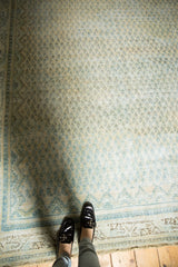 Distressed ivory and blue Mir boteh pattern, with worn texture and visible foundation.