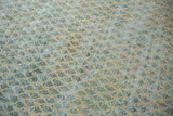 Distressed Mir boteh motifs in ivory, powder blue, and brown, revealing worn pile texture.