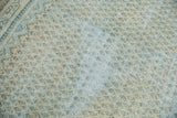Distressed Mir Arak carpet detail showing worn allover boteh pattern with visible foundation.