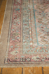 Distressed vintage Hamadan rug border, with blush, sky blue geometric florals and low, worn pile.