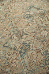 Distressed Mehrivan carpet section, geometric floral and serrated leaf motifs, faded teal, even wear.