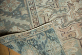 Distressed vintage Mehrivan rug showing even pile wear and hand-knotted backing.