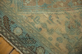 Distressed vintage Northwest Persian rug corner, aqua blue and sand pile, faint foundation, and fringe.