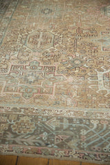 Distressed Karaja carpet, geometric pattern with sand, blush, dusty teal, and softened pile.