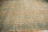 Distressed vintage Karaja rug corner, intricate geometric field and border in sand, blush, and dusty teal.