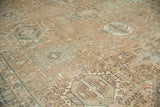 Distressed vintage Karaja carpet, intricate geometric and floral patterns in soft colors.