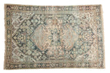 Distressed Hamadan rug, oversized medallion, low pile showing foundation, beige, and blue tones. 3'5
