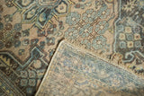 Vintage Distressed Hamadan rug pile with knot heads, revealing its intricate woven foundation.