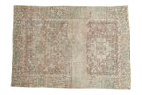 Distressed vintage Karaja rug with triple medallion in softened ivory, blush, and powder blue.
