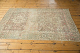 Distressed vintage Karaja rug, with decorative wear, faint foundation, and geometric motifs.