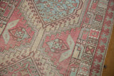 Distressed Serab runner's pale raspberry, sea foam geometric medallions and pawn border.