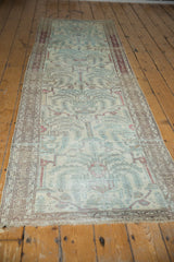 Distressed Malayer runner, powder blue tree of life motif, ivory field, wine red borders.