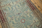 Distressed Malayer rug's powder blue, ivory pattern with wear to knot heads and foundation.