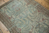 Faded blue, beige, and red tones on the distressed vintage Malayer runner.