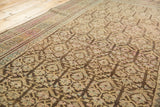 Faded tree of life and pawn motifs on a distressed Kurdish rug runner, showing pile wear.