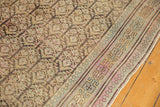 Soft antique tones and pawn motif on the border of a distressed vintage Kurdish runner.
