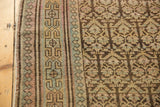 Distressed border with reciprocating pawn motif and adjacent germinating tree of life field.