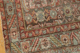 Distressed Malayer runner close-up, worn Herati and palmette motifs in teal, burgundy, gold.