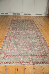 Distressed Malayer runner end, with Herati pattern, serrated leaf border, worn pile, and exposed foundation.