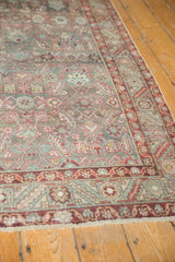 Distressed Malayer runner with worn Herati mahi motif, serrated leaf border, soft teal and wine red tones.