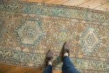Distressed vintage Karaja runner with geometric floral vinery in dusty gold and powder blue.